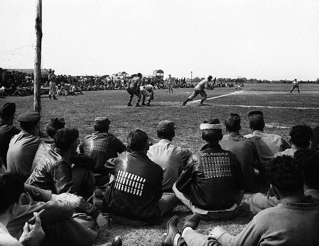 USAAF game in England.jpg - ca. 1941, England, UK --- Members of the United States Air Force take part in a inter-station basball match in celebration of their 100th mission, ca. 1941. --- Image by © Hulton-Deutsch Collection/CORBIS